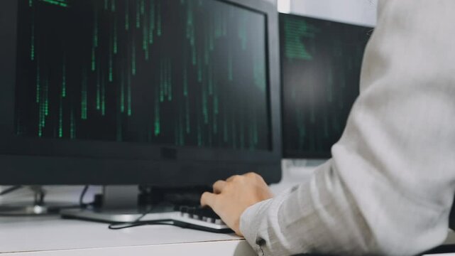 Two asian team working development of programming and encryption technology website design programmers on desk in office