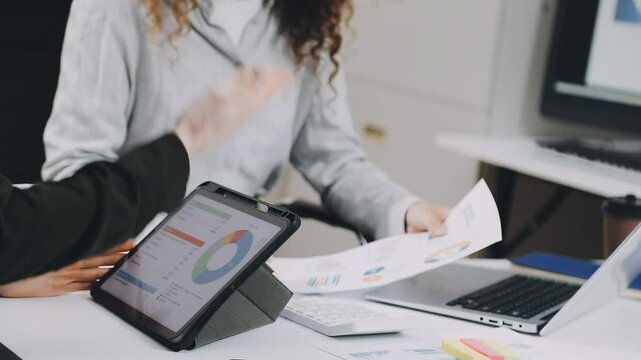 Two asian team working development of programming and encryption technology website design programmers on desk in office