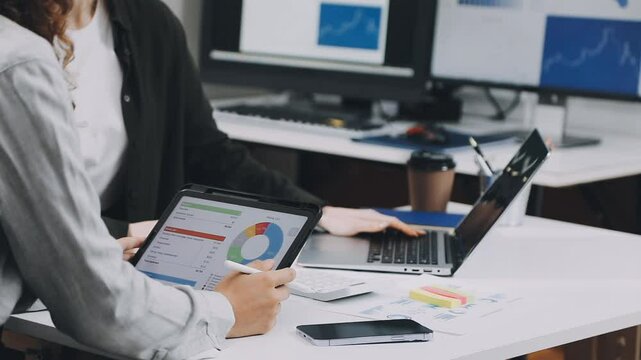 Two asian team working development of programming and encryption technology website design programmers on desk in office