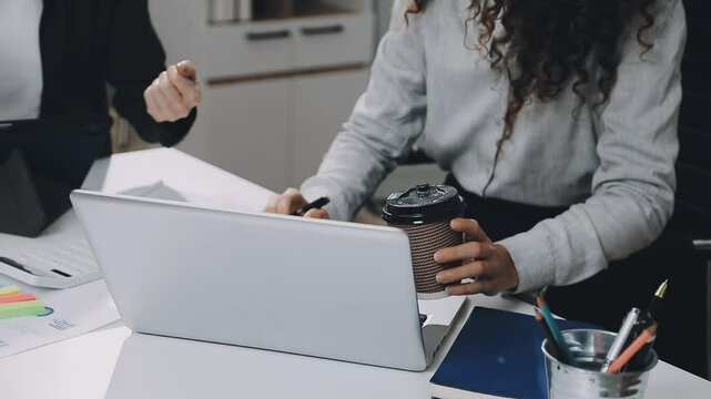 Two asian team working development of programming and encryption technology website design programmers on desk in office