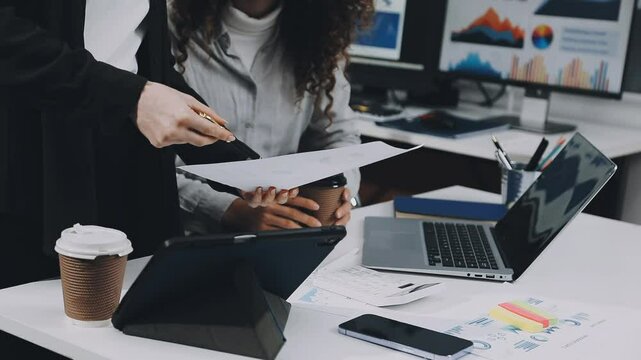 Two asian team working development of programming and encryption technology website design programmers on desk in office