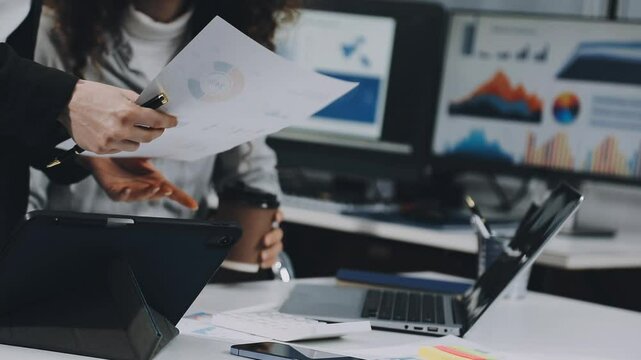 Two asian team working development of programming and encryption technology website design programmers on desk in office