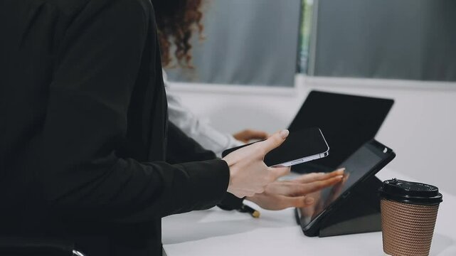 Two asian team working development of programming and encryption technology website design programmers on desk in office