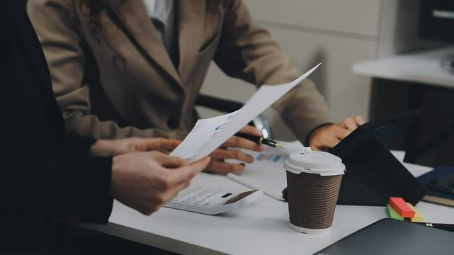 Two asian team working development of programming and encryption technology website design programmers on desk in office