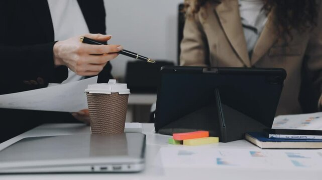 Two asian team working development of programming and encryption technology website design programmers on desk in office