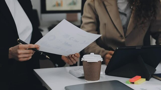 Two asian team working development of programming and encryption technology website design programmers on desk in office