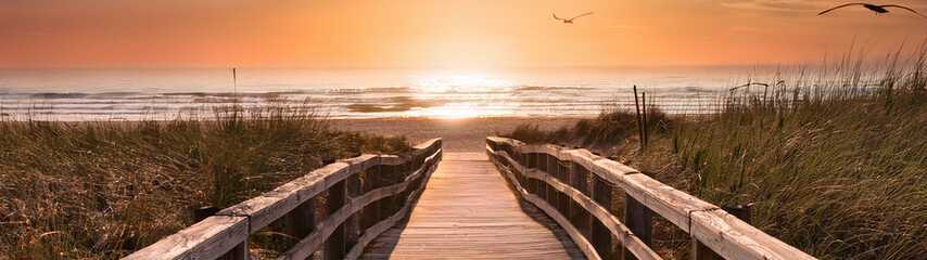 Fototapeta premium Beach Boardwalk at Golden Hour Sunset