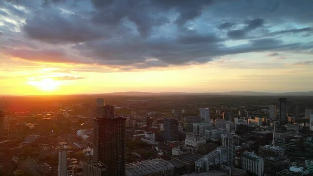 Aerial View of Greater Manchester Central City During Sunset, England Great Britain. Drone Camera Footage Was Captured During Cloudy Sunset Time on May 4th, 2024