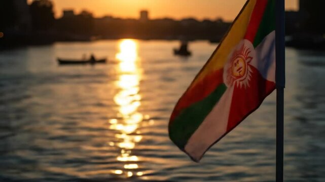Burmese Flag Waves at Sunset Over River