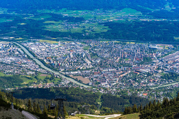 Aerial view of Innsbruck city with Inn river from Seegruben cable car station in spring on a sunny day, Innsbruck, Austria