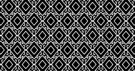 Elegant black and white decorative pattern with ornate symmetrical shapes, ideal for luxury packaging or textile.