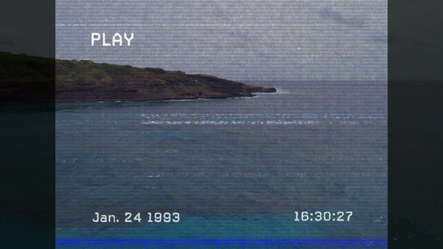 PLAY flashing starting tape playback, headland staying still, waves sweeping, timestamp advancing