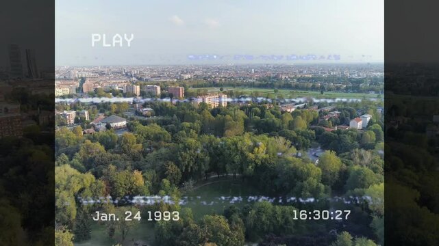 Timestamp updating each second and glitch bars drifting across park clearing simulating tape damage