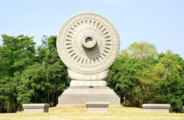  Spinning dharma wheel in ornate Asian temple  