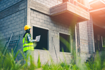 Architect works with digital construction plan and precise data during home inspection process.