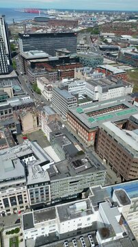 Aerial View of Historical and Modern Central Town Center and Downtown Buildings at British City Centre of Liverpool, Maritime city in northwest England, United Kingdom on Beach and Ocean Docks.