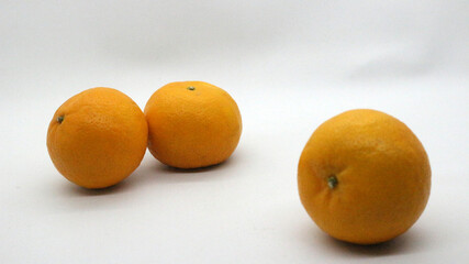 Fresh oranges on white background
