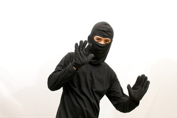 concept of catching a thief,thief surrenders caught by the police isolated on white background