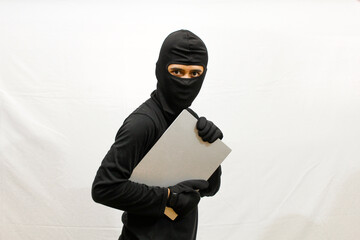 thief stealing laptop computer isolated white background .criminal concept