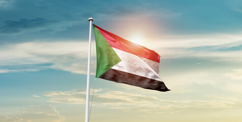 Sudan flag waving in beautiful sky with mast. A proud moment flag waving with sunlight.