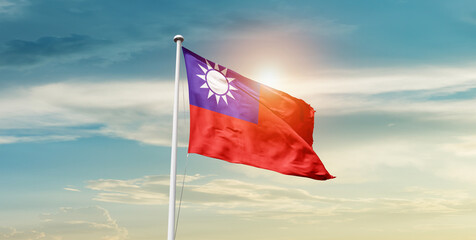 Fototapeta premium Taiwan flag waving in beautiful sky with mast. A proud moment flag waving with sunlight.
