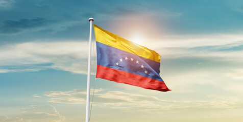 Venezuela flag waving in beautiful sky with mast. A proud moment flag waving with sunlight.