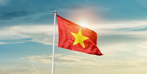 Vietnam flag waving in beautiful sky with mast. A proud moment flag waving with sunlight.
