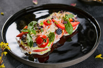 Bruschetta with crab on glossy black plate, vibrant natural light, fresh garnish, minimalist food styling