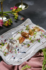 Assorted candies on artistically plated porcelain, bright lighting, luxury color palette