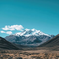 Fototapeta premium A breathtaking view of a snow-capped mountain range under a clear blue sky --