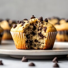 Close-up of a chocolate chip muffin with a bite taken out -