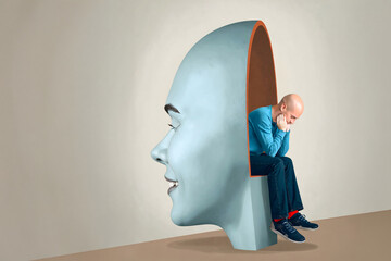  symbolizing the mind. Inside the head, a person  sits thoughtfully, resting their head on their hand. The minimalist background enhances the surreal and introspective mood of the scene.