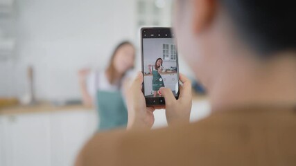 Young asian womans shooting together dancing in kitchen at house when making video for social media, stories trendy dance at home make online content - Powered by Adobe