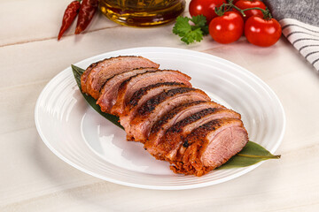 Sliced duck breast baked with cherry