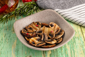 Tasty hot grilled champignon mushrooms