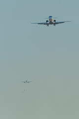 Multiple airplanes in a line approach for landing.