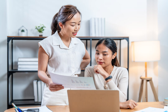 Efficient marketing planning is essential for cosmetic packaging success as two professionals collaborate on strategies while reviewing data and insights in modern office setting