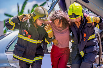 Firefighter emergency rescue help young woman from dangerous smoke and burning accident. - Safety and rescue operation comcept