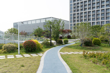 footpath through garden on rooftop of modern office building