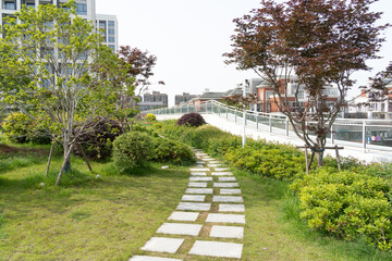 footpath through garden on rooftop of modern office building