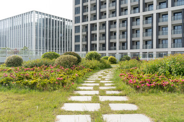 footpath through garden on rooftop of modern office building