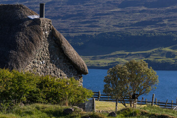 Old traditional thatched and stone walled crofter house near Stein in Loch bay, Waternish peninsula, Isle of Skye, Scotland © Lars Gieger