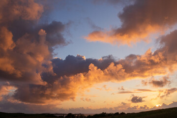 Dramatic cloudscape with iilluminated clouds at Loch bay at the Waternish peninsula.