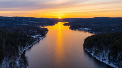 Breathtaking Aerial Panoramic Serene Golden Sunrise Landscape Concept. Majestic Sunset Over Calm River Surrounded by Scenic Forest Landscape in Winter Season