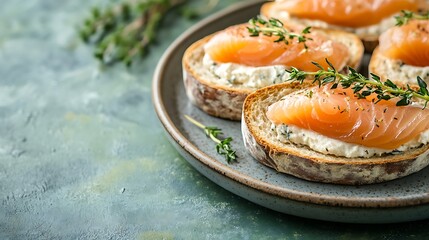 Salmon CanapÃ©s with Cream Cheese, Thyme Sprigs on Toasted Bread on Plate