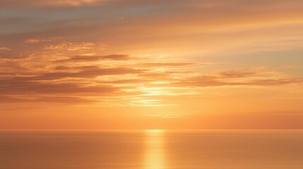 Fototapeta premium Golden Sunset Over Calm Ocean with Sun Reflection