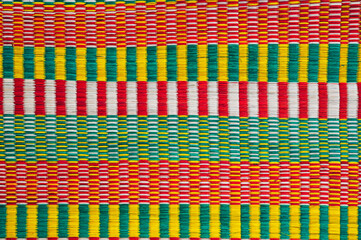 texture of woven reed mat in Vietnam. Background with a pattern of woven dyed straw traditional Vietnamese rug