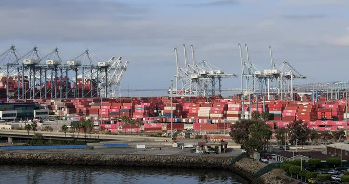 Long Beach California container cargo port cranes train. Long Beach container port. Gateway for US, Asian and China trade. Busiest largest cargo port facility on west coast of USA.