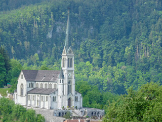 Switzerland, Meiringen, a castle like building with a mountain in the background