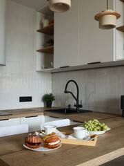 This is a modern kitchen featuring a fresh food arrangement that enhances the culinary experience